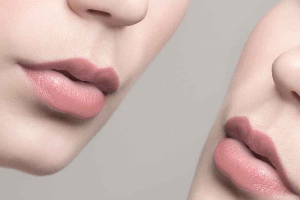 Close up of ladies lips and cheeks on either corner of the picture